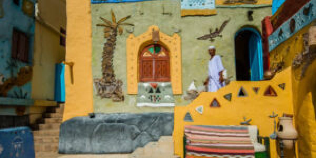 A Nubian man walks outside a traditional Nubian house, Aswan Egypt, August 2015